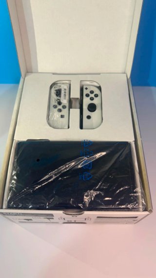 Nintendo Switch OLED con caja como nueva + juego