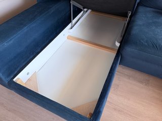 Sofá chaiselongue cama azul con arcón