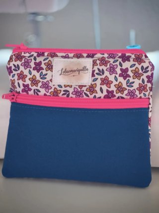 Monedero bicolor flores multicolor/azul