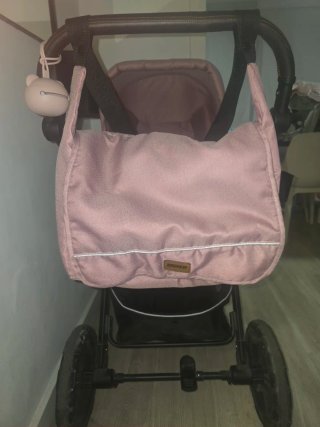 Carrito de bebé rosa con silla para coche