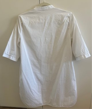 Blusa blanca bolsillos Uterqüe