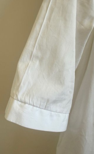 Blusa blanca bolsillos Uterqüe