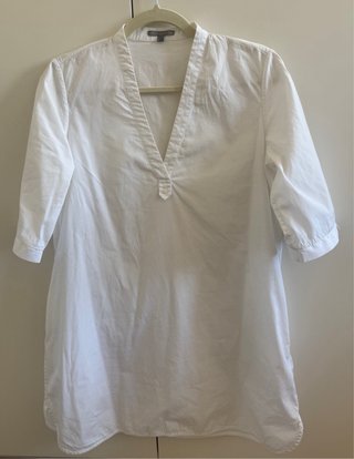 Blusa blanca bolsillos Uterqüe