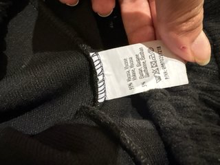 Pantaloni neri in lana a zampa