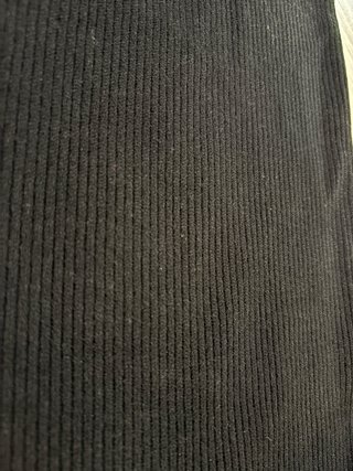 Pantaloni neri in lana a zampa