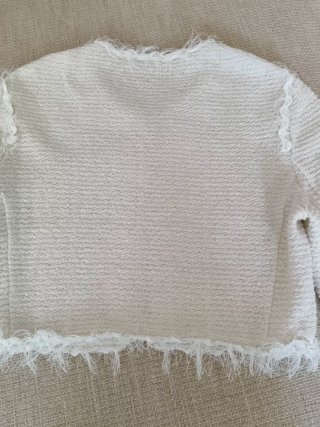Chaqueta corta de punto con hilo plateado