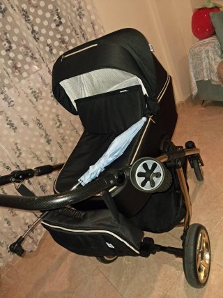 Passeggino per neonati nero e dorato