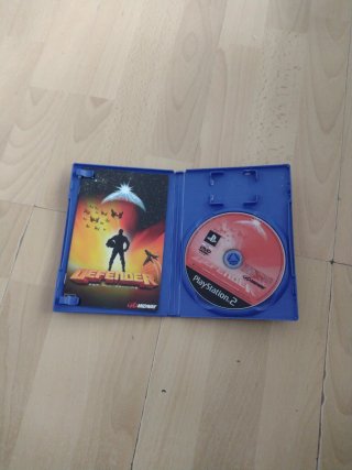Defender PS2 con manual