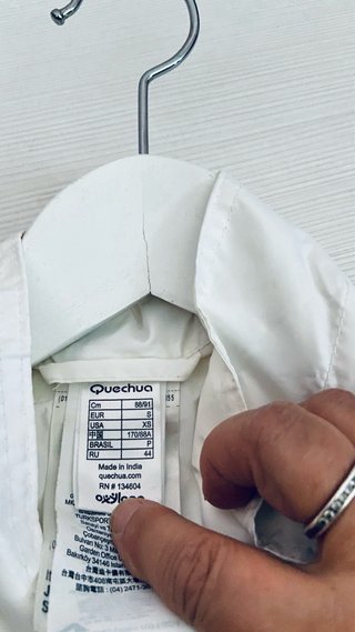 Chubasquero Quechua blanco talla S
