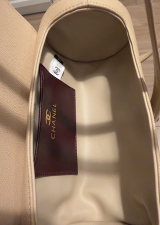 Bolso redondo beige sin estrenar