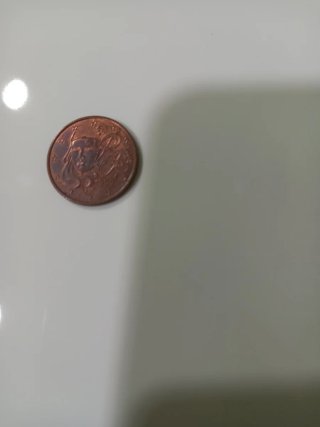 Moneda de 1 Dólar Sacagawea 2000 otra 5 céntimos.