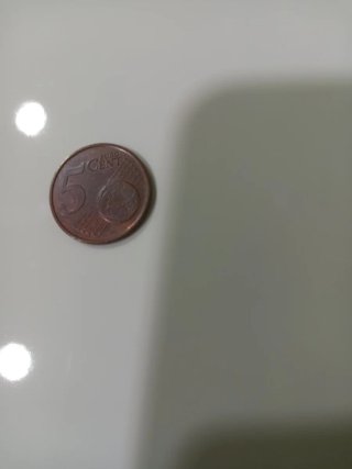 Moneda de 1 Dólar Sacagawea 2000 otra 5 céntimos.