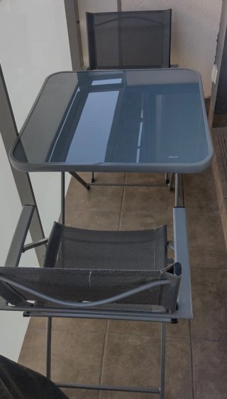 Mesa y 2 sillas terraza cristal