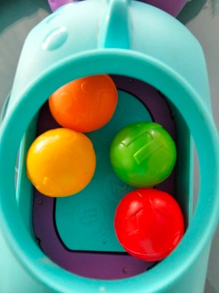 Juguete Fisher Price Dinosaurio con Pelotas