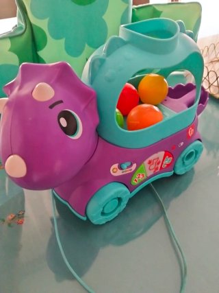 Juguete Fisher Price Dinosaurio con Pelotas