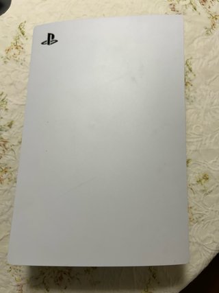 PlayStation 5 con 2 mandos, juegos y volante