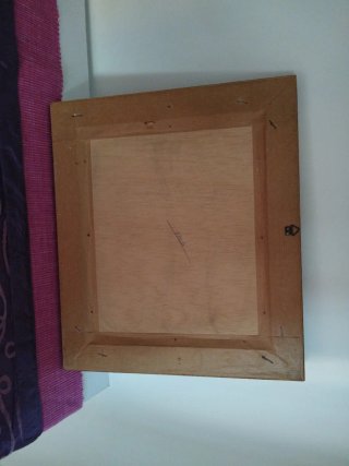 Cuadro de madera con amazona a caballo.