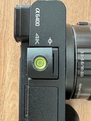 Nivel de burbuja zapata + funda silicona Sony A640