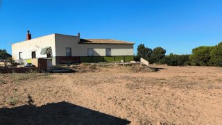 Terreno con casa
