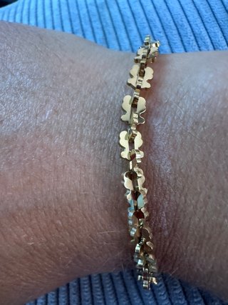 Pulsera de acero con ositos dorados