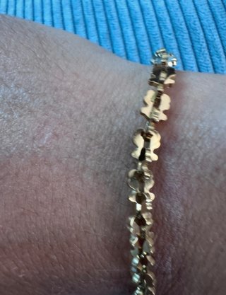 Pulsera de acero con ositos dorados