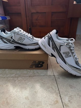New Balance 509 Plata y Blanco