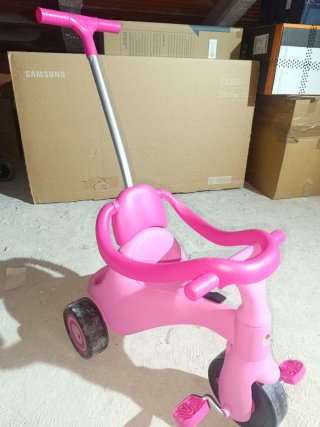 Triciclo infantil rosa con empujador