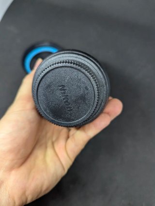 Tazza a forma di obiettivo Nikon con coperchio