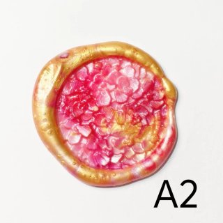 Sello de lacre dorado y rosa