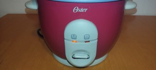 Arrocera Oster 0.6 litros con Vaporera, 3 raciones