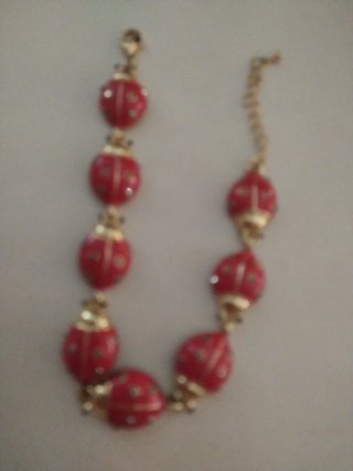 Bracciale vintage dorato con coccinelle