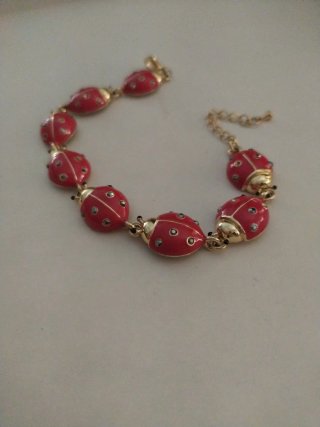 Bracciale vintage dorato con coccinelle