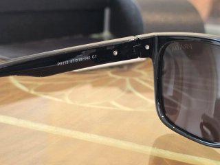 Gafas de sol Prada negras brillantes