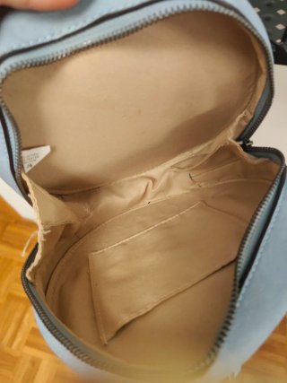 Bolso redondo azul claro con flecos