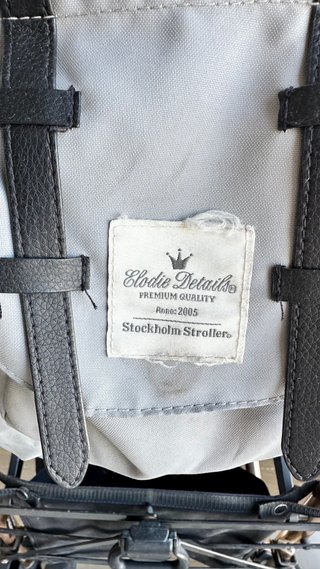 Silla de paseo ligera gris y oro