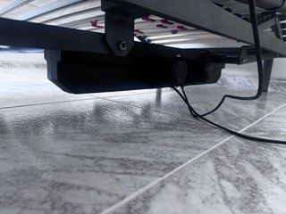 Cama articulada gris y blanca