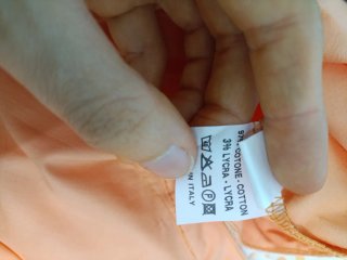 Maglia arancione con paillettes