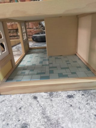 Casa de muñecas de madera