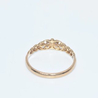 Anillo calado oro 18k con pedrería entrelazada