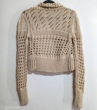 Capispalla beige traforato