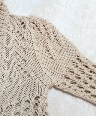 Capispalla beige traforato