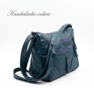 Bolso azul con múltiples cremalleras funcionales
