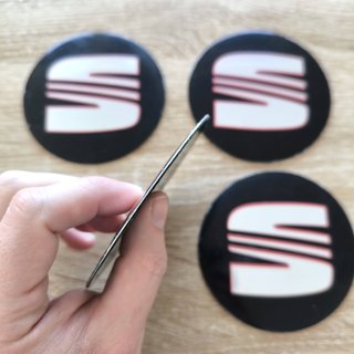 TAPABUJES SEAT 90mm PEGATINA NEGRO LOGO PLATA ROJO