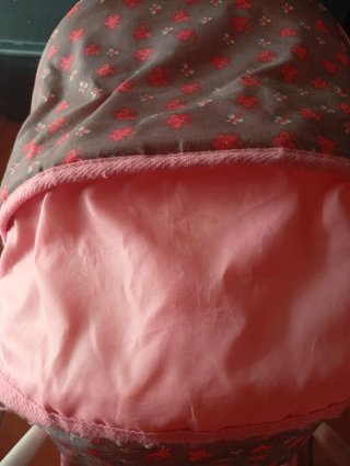 Carro gemelar de juguete rosa