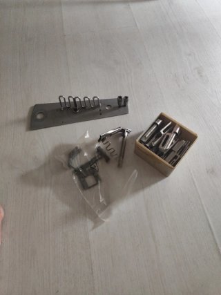 Aparato de vivear para máquina de coser