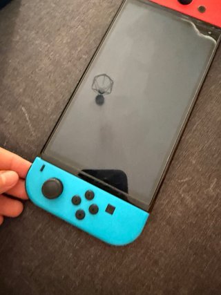 Nintendo Switch OLED negra con naranja