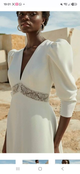 Vestido de novia de corte imperio con velo