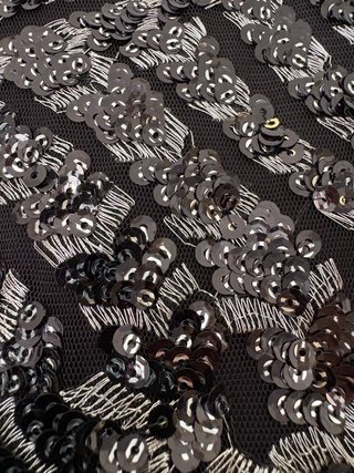 Falda corta lentejuelas negra y plateada