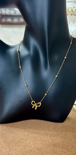 Collana fiocco con sfere in acciaio