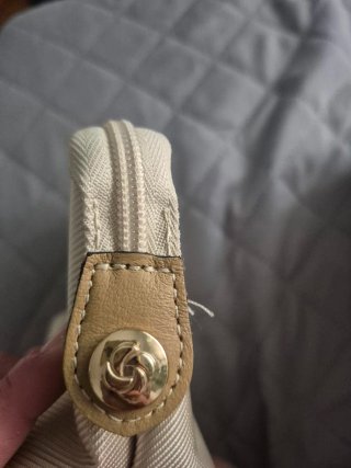 Neceser de viaje Samsonite beige y dorado